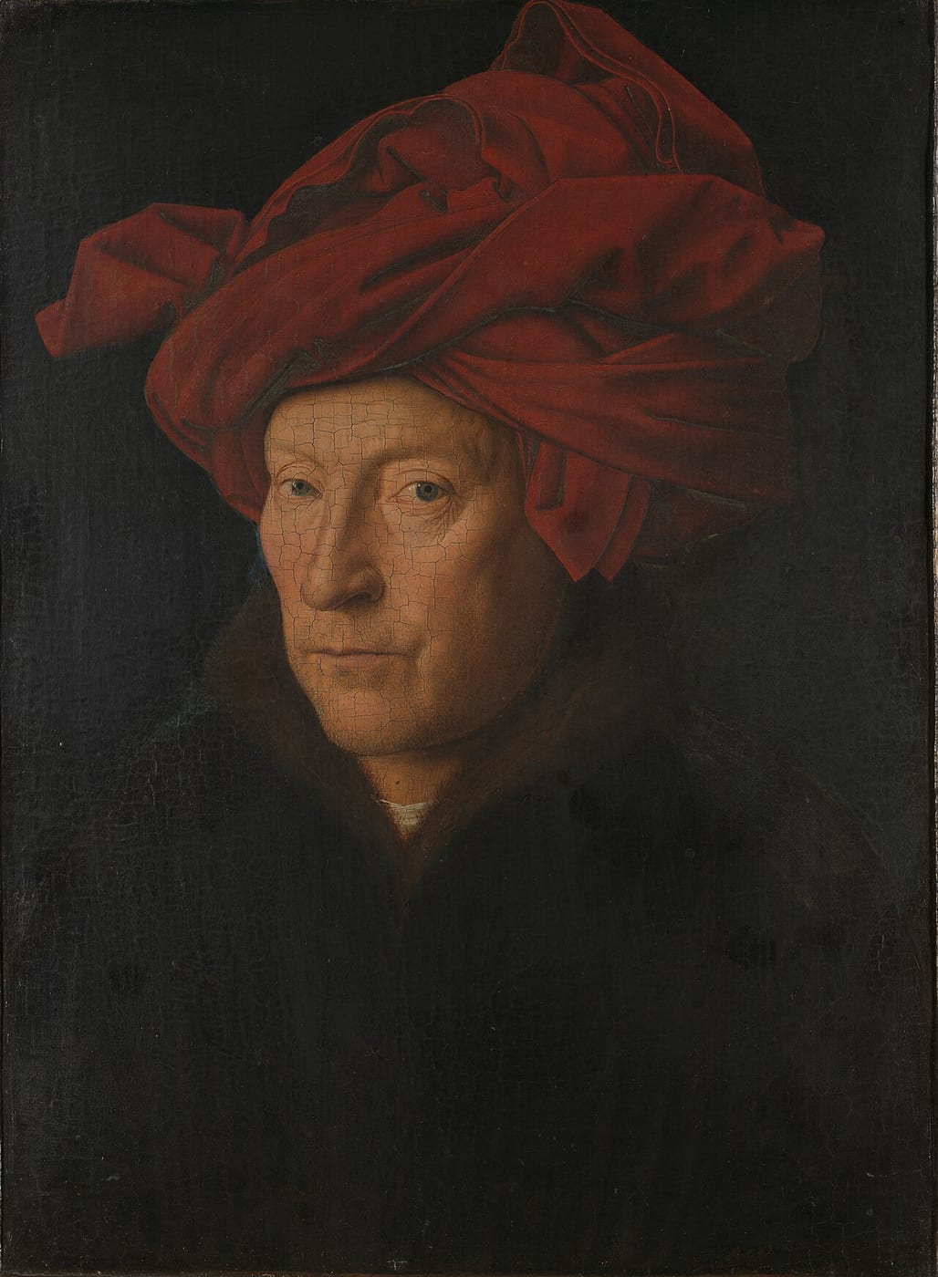 Jan van Eyck’s Portrait of a Man, showing a man wearing a folded red headdress.