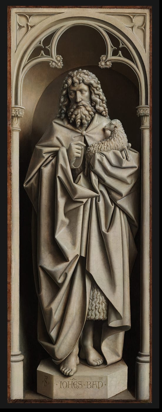 Saint John the Baptist painted in grey to resemble a stone statue, holding a lamb.